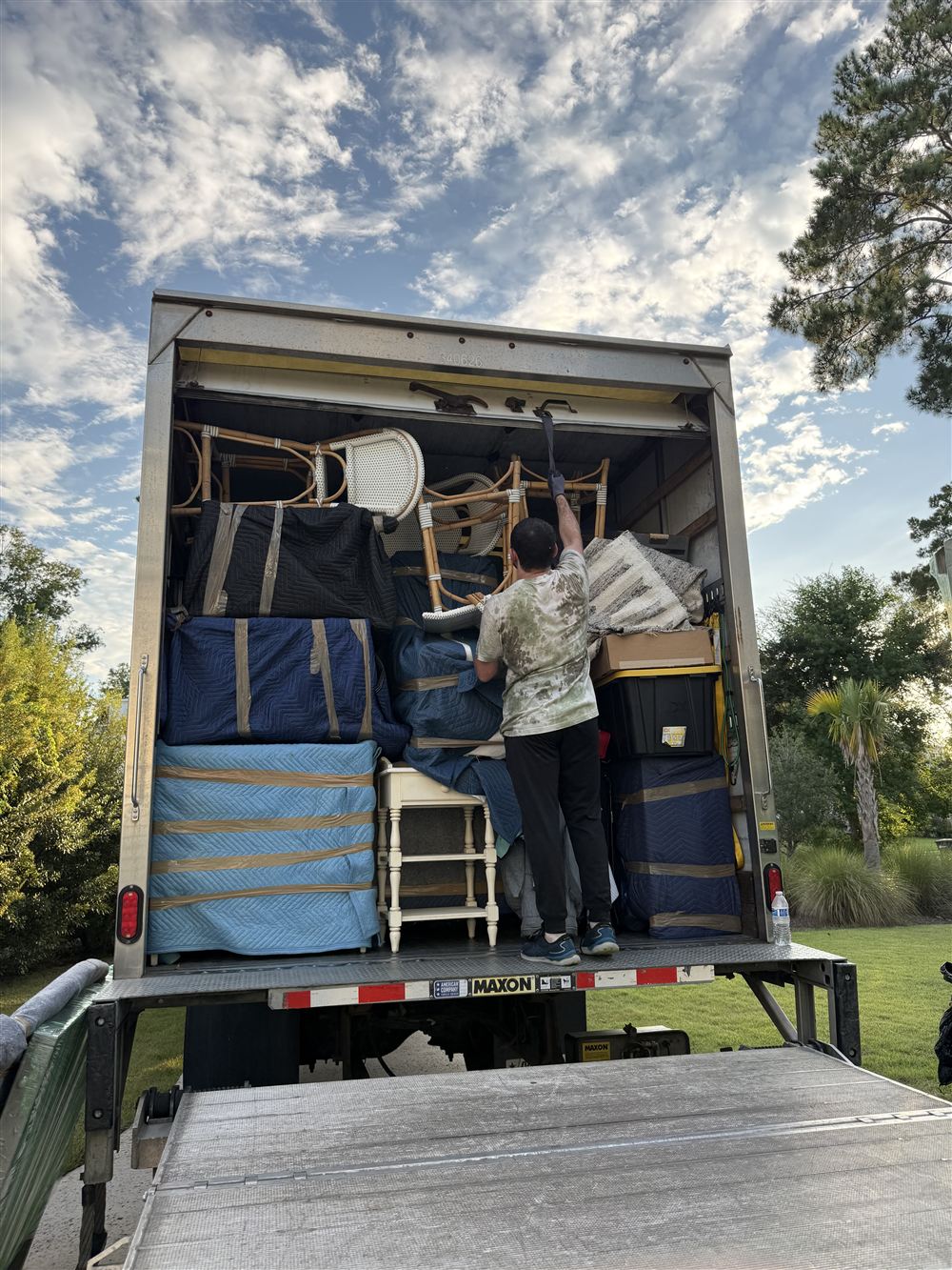Queen Street Movers truck loaded with padded furniture